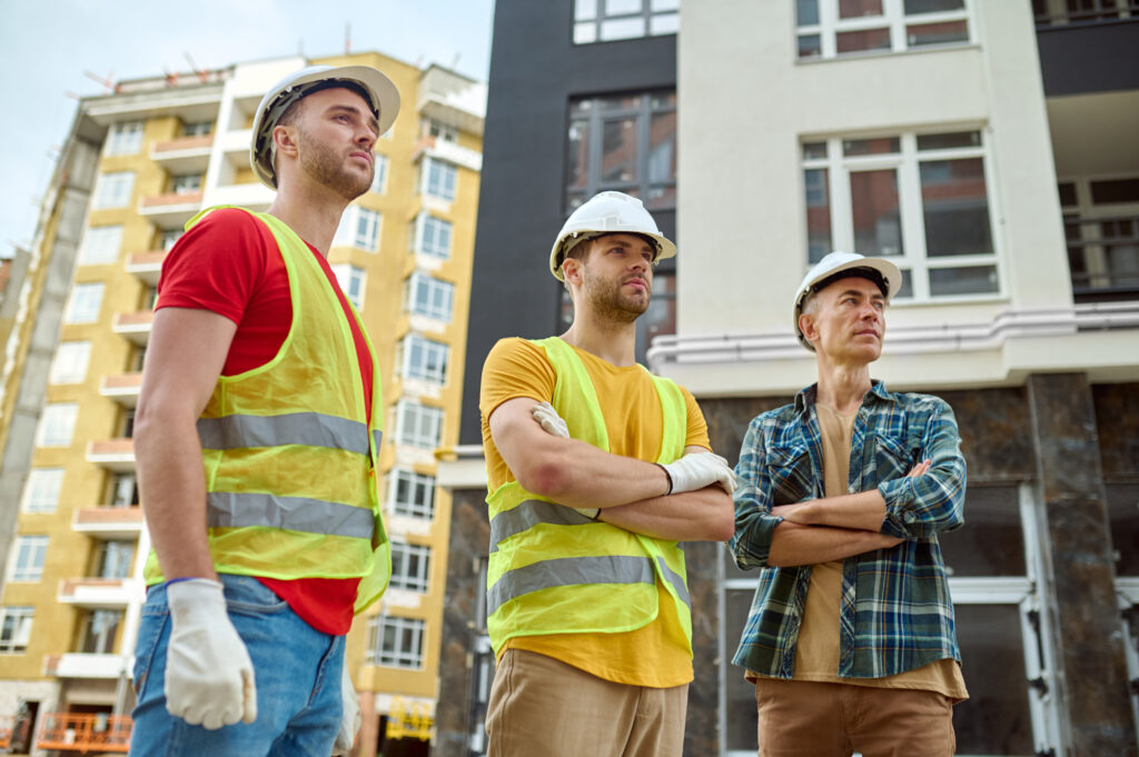 DL Interiors team assessing site for renovation plans on-site for a multi-unit apartment building in Ireland.